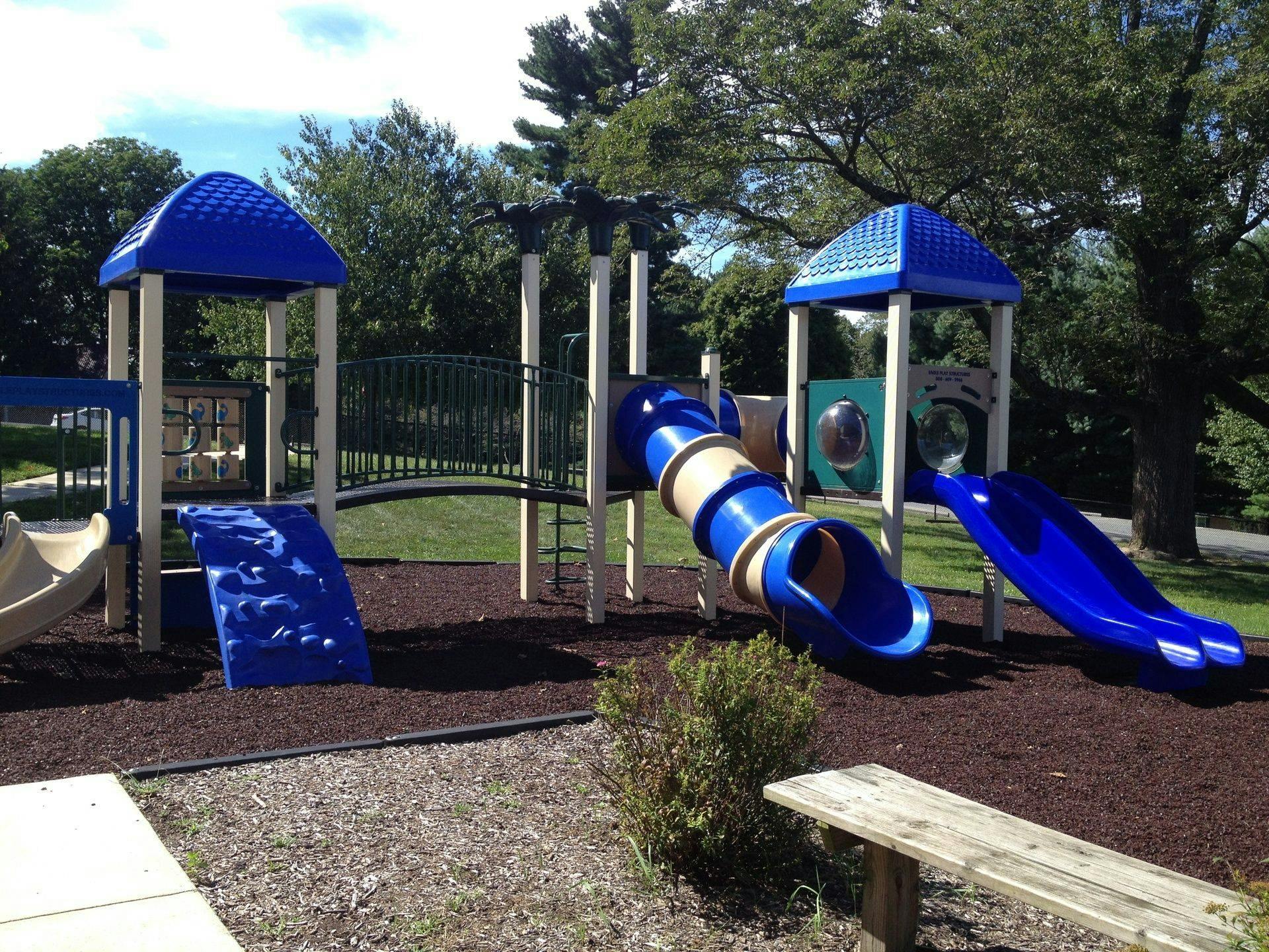Empty playground with slides and climbing structures