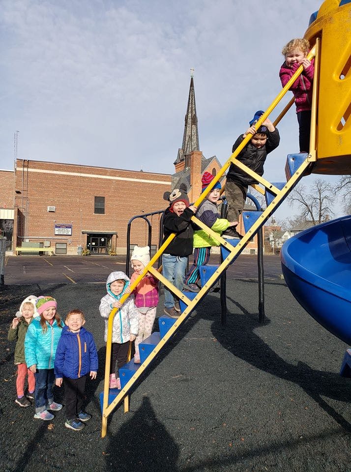 Children climbing on a playground structure