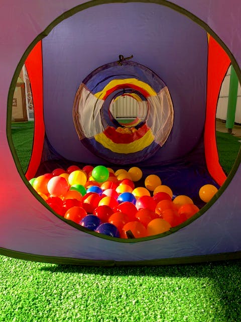 Play tunnel with colorful ball pit