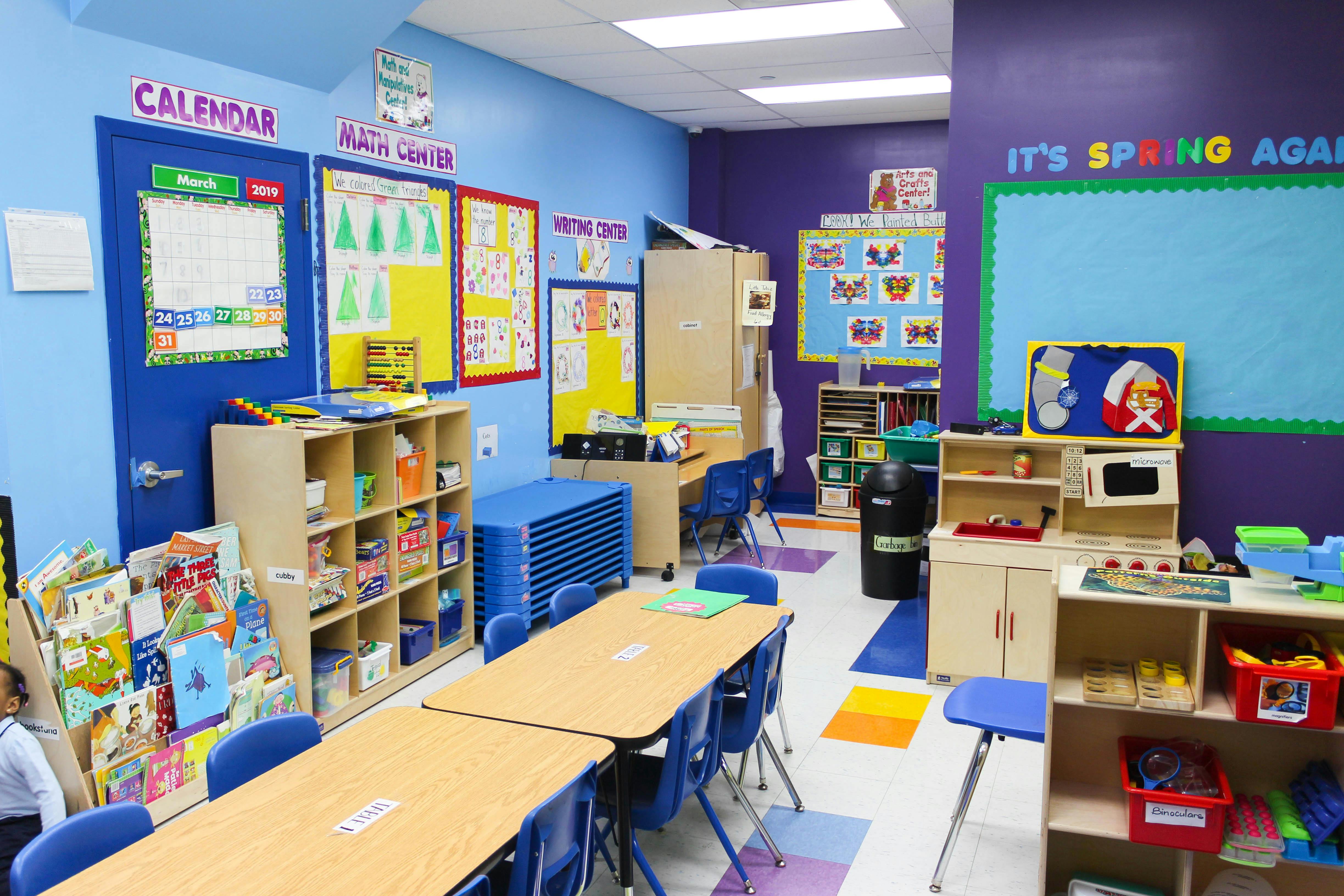 Classroom with tables, chairs, and learning materials