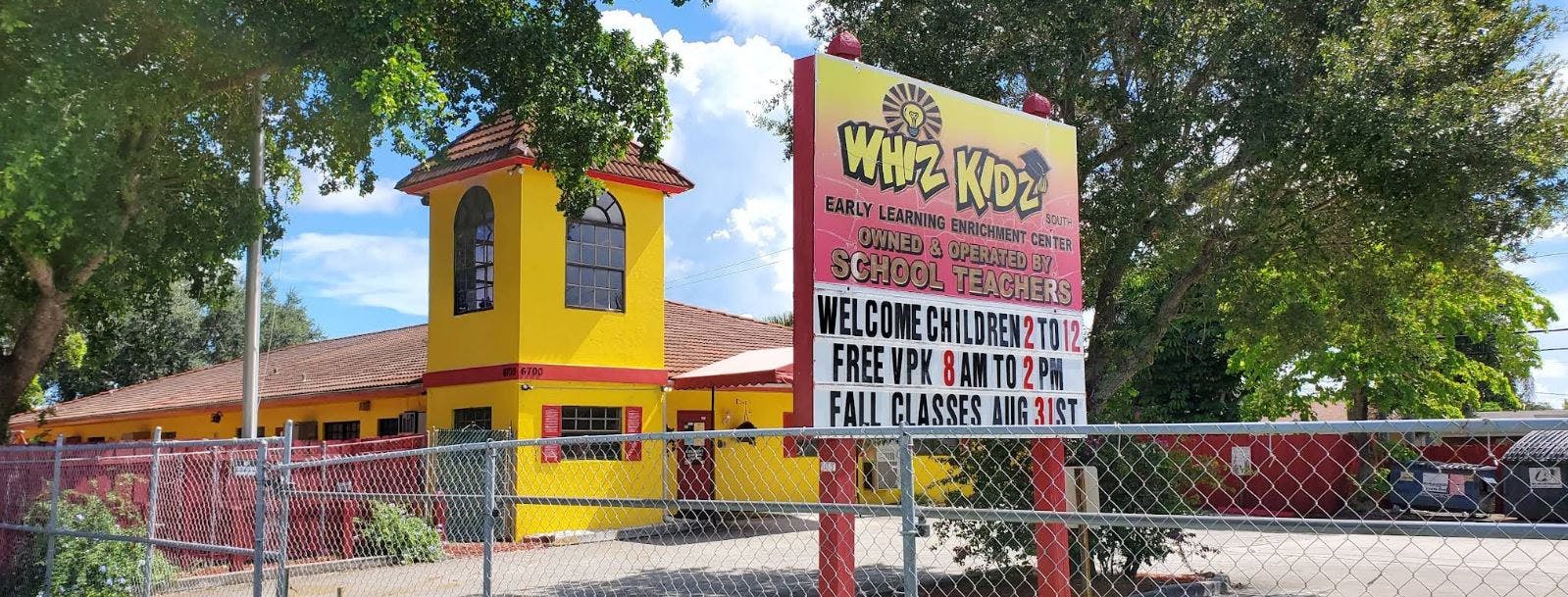 Yellow building with a sign that reads "Whiz Kidz"