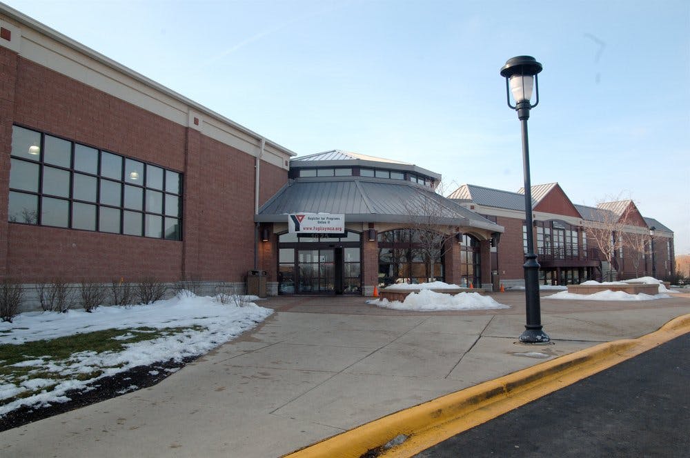 Brick building with a circular entrance and snow on the ground
