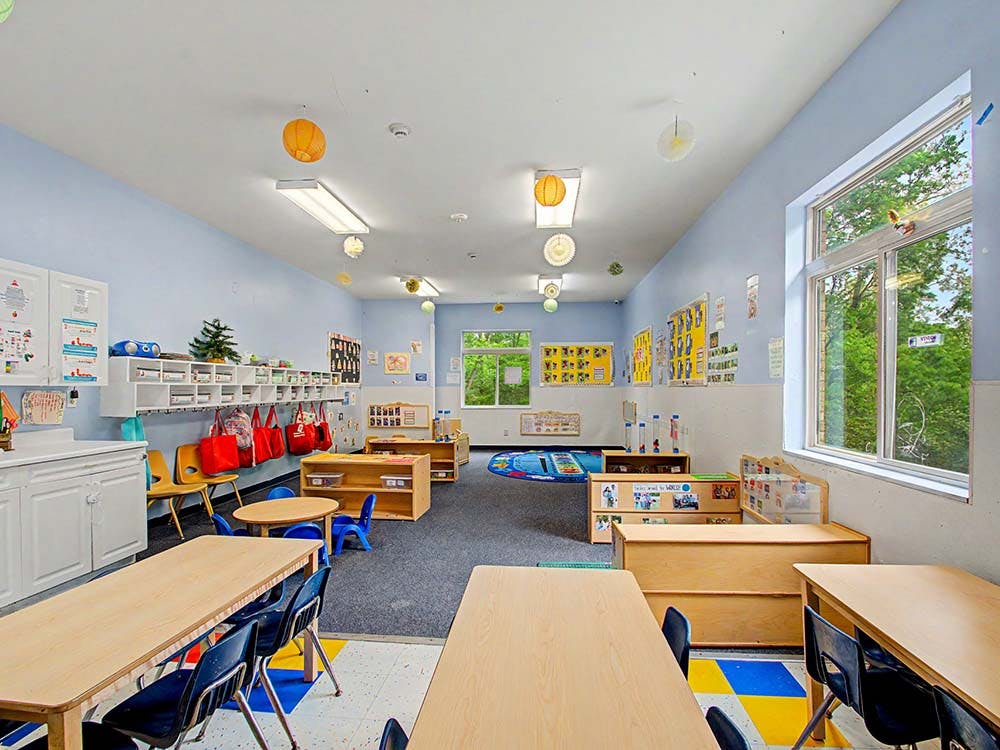 Classroom with child-sized tables and chairs
