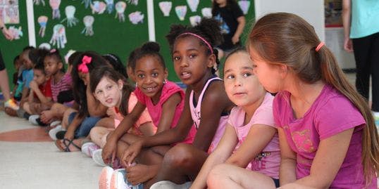 Group of children sitting on the floor