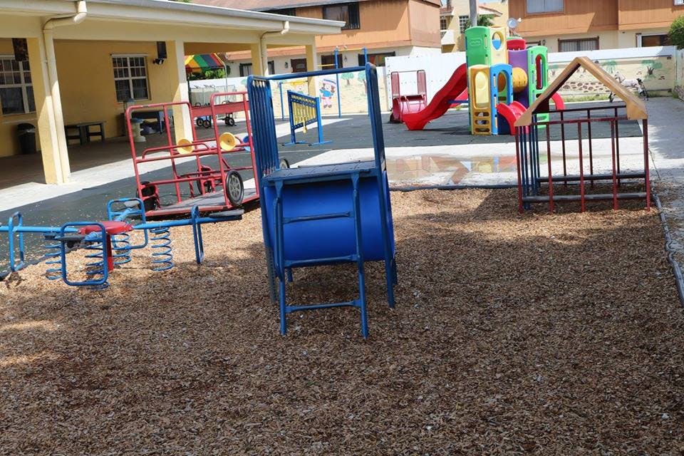 Playground with various play equipment on wood chips