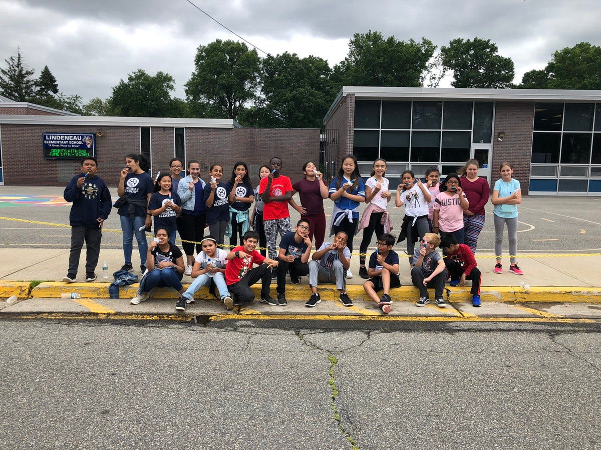 Group of children and teens posing outdoors