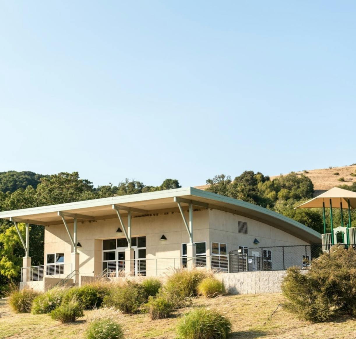 Modern building with a slanted roof and large windows