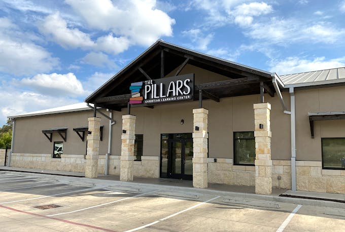 The exterior of The Pillars Christian Learning Center building