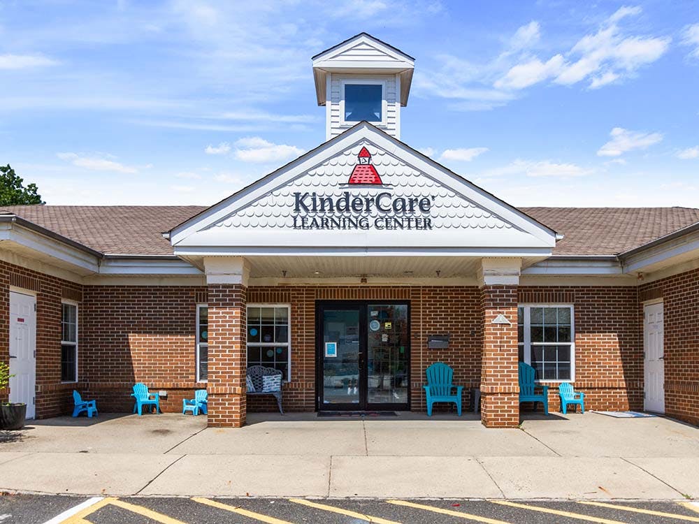 KinderCare Learning Center building with red brick and white trim