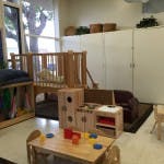Playroom with wooden furniture and toys