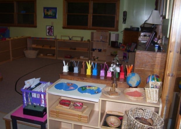 Classroom with shelves of learning materials and a globe