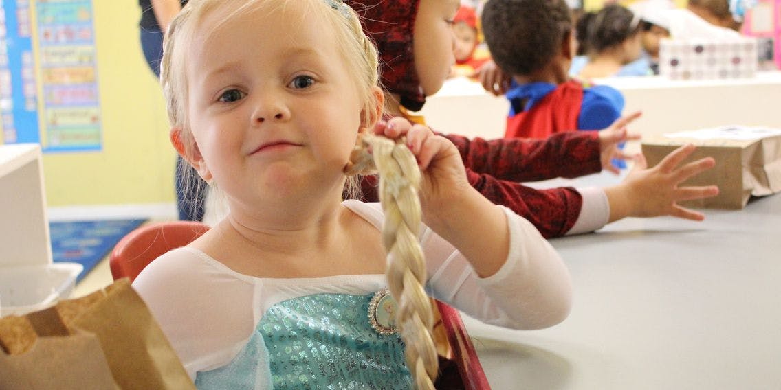 Child holding a braided object