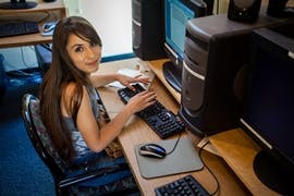 Person typing on a computer keyboard