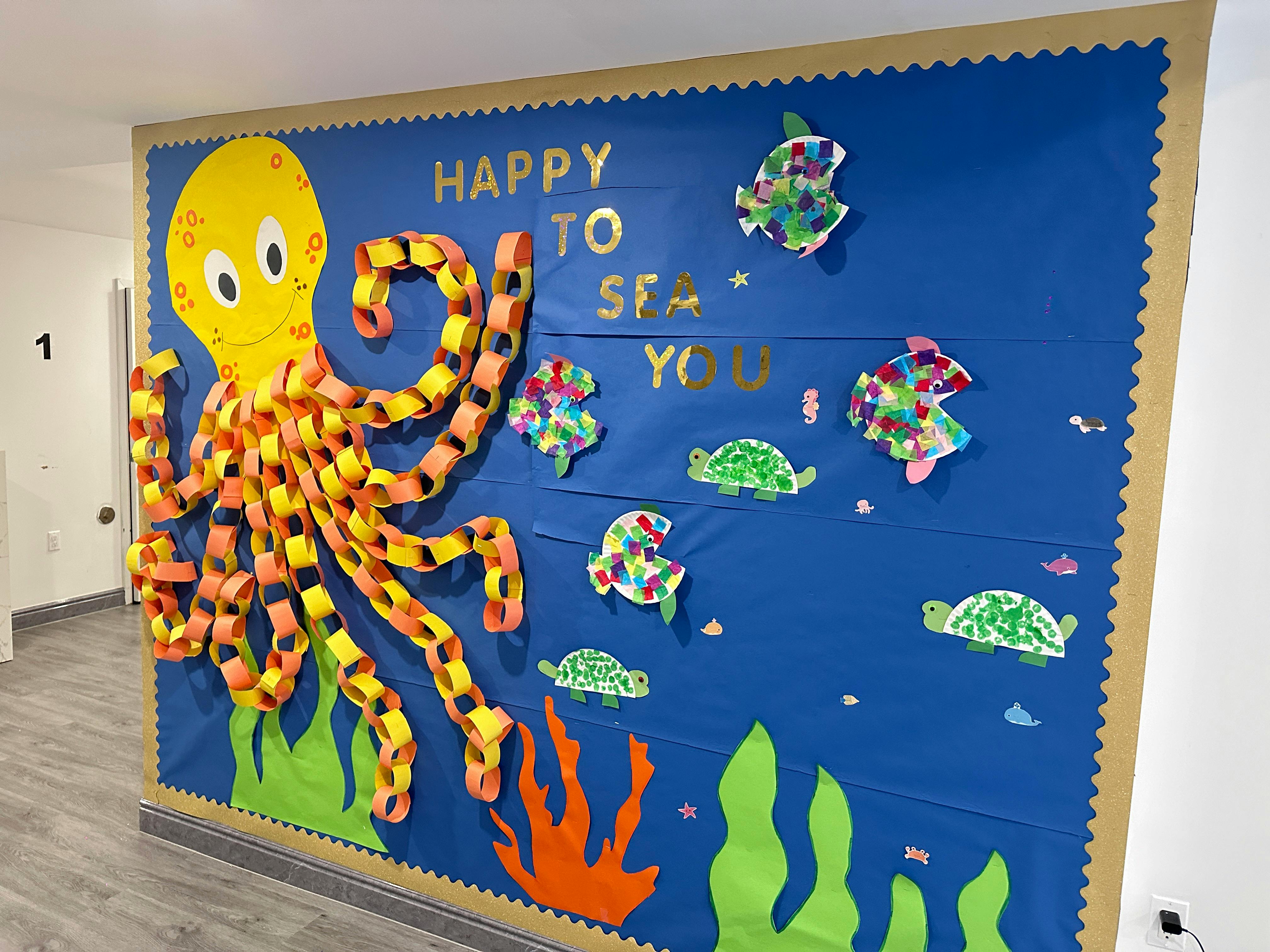 Octopus and sea creatures bulletin board with "Happy to Sea You" text