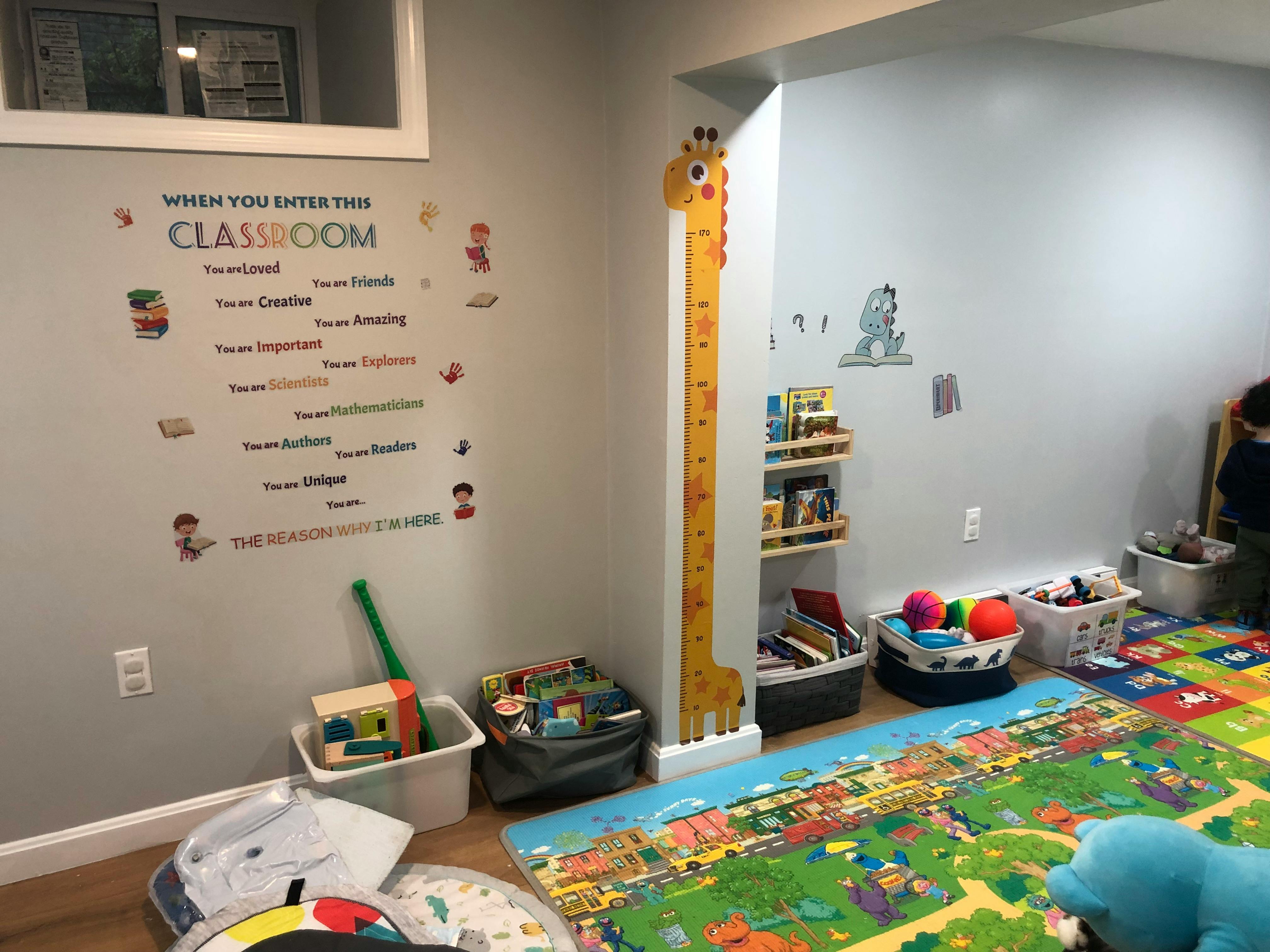 Classroom with a wall decal that reads "When you enter this classroom"