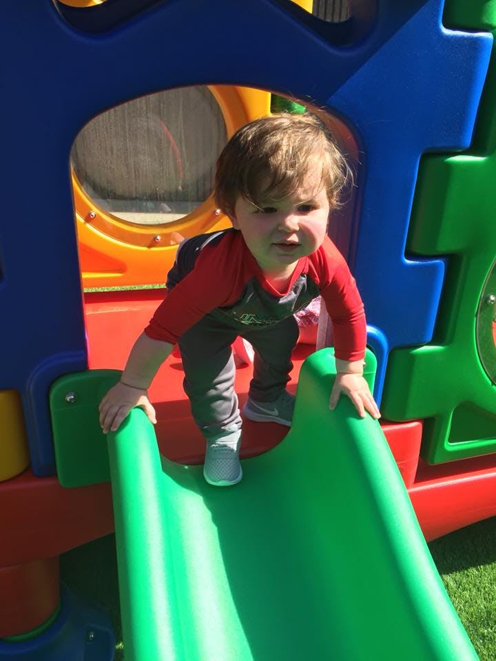 Child on a playground slide