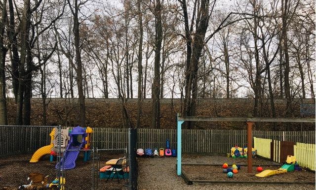 Outdoor playground with slides, swings, and toys
