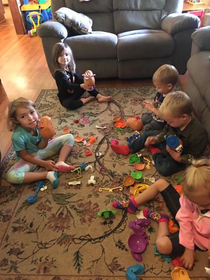 Children playing with toys on a rug