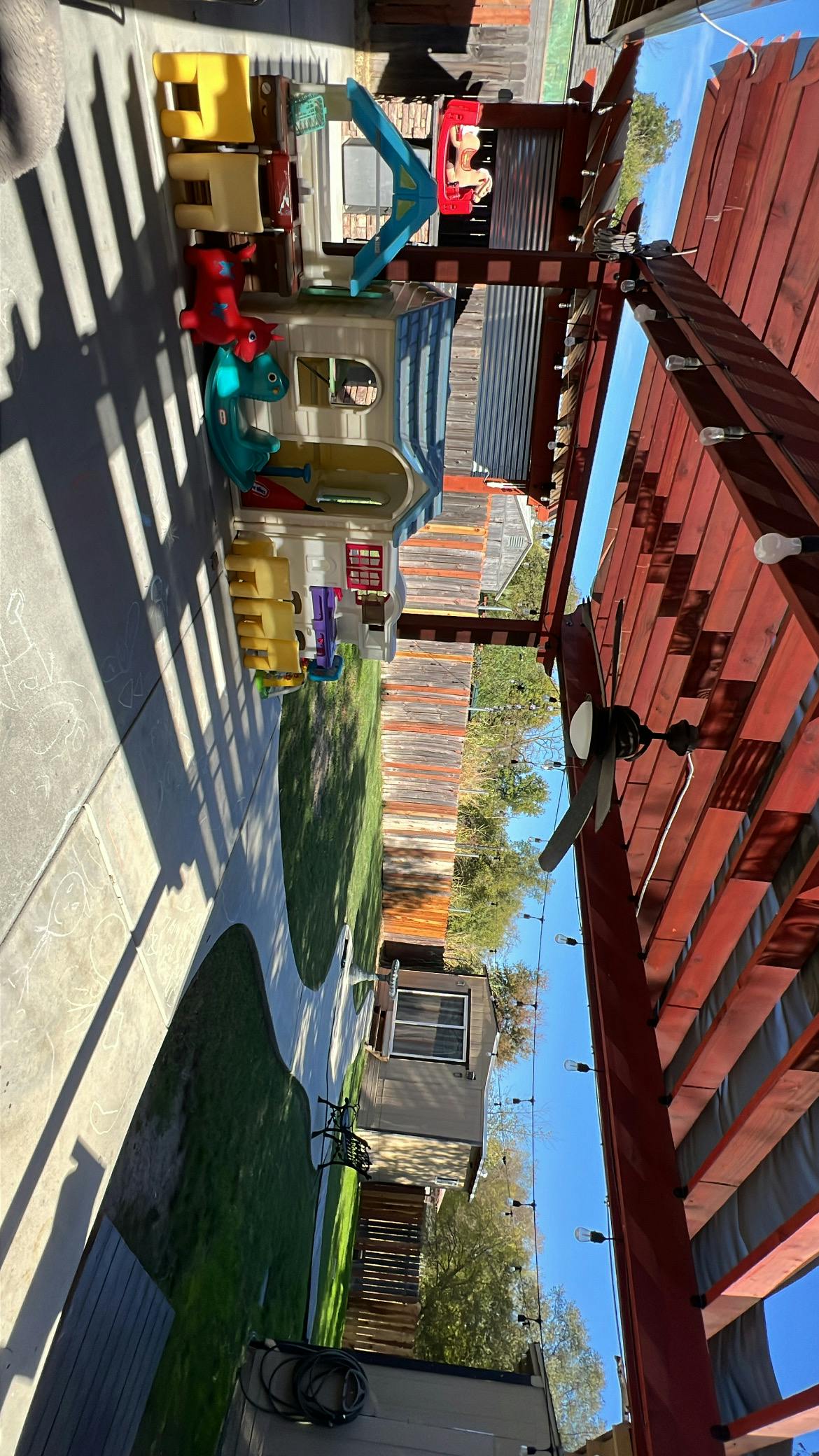 Playhouses and outdoor toys on a patio