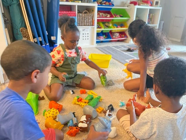 Children playing with toys on the floor