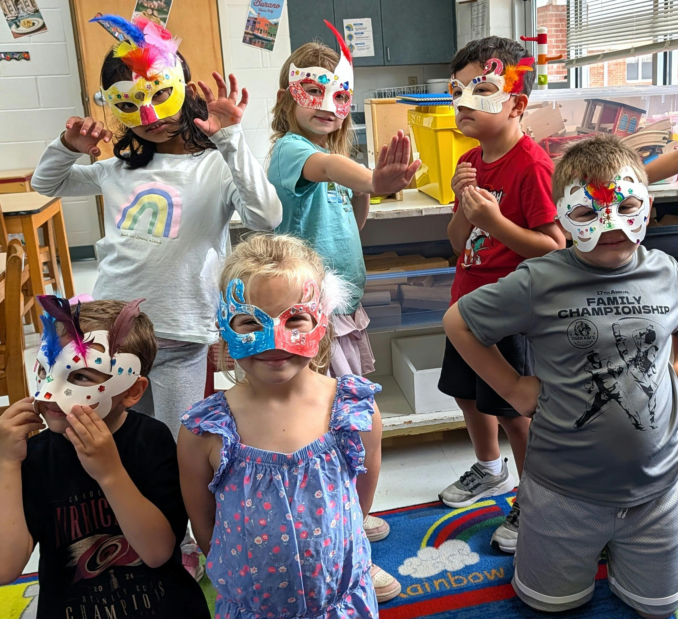 Group of children wearing decorative craft masks in a classroom