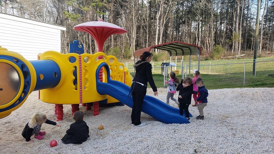 Person with children on a playground