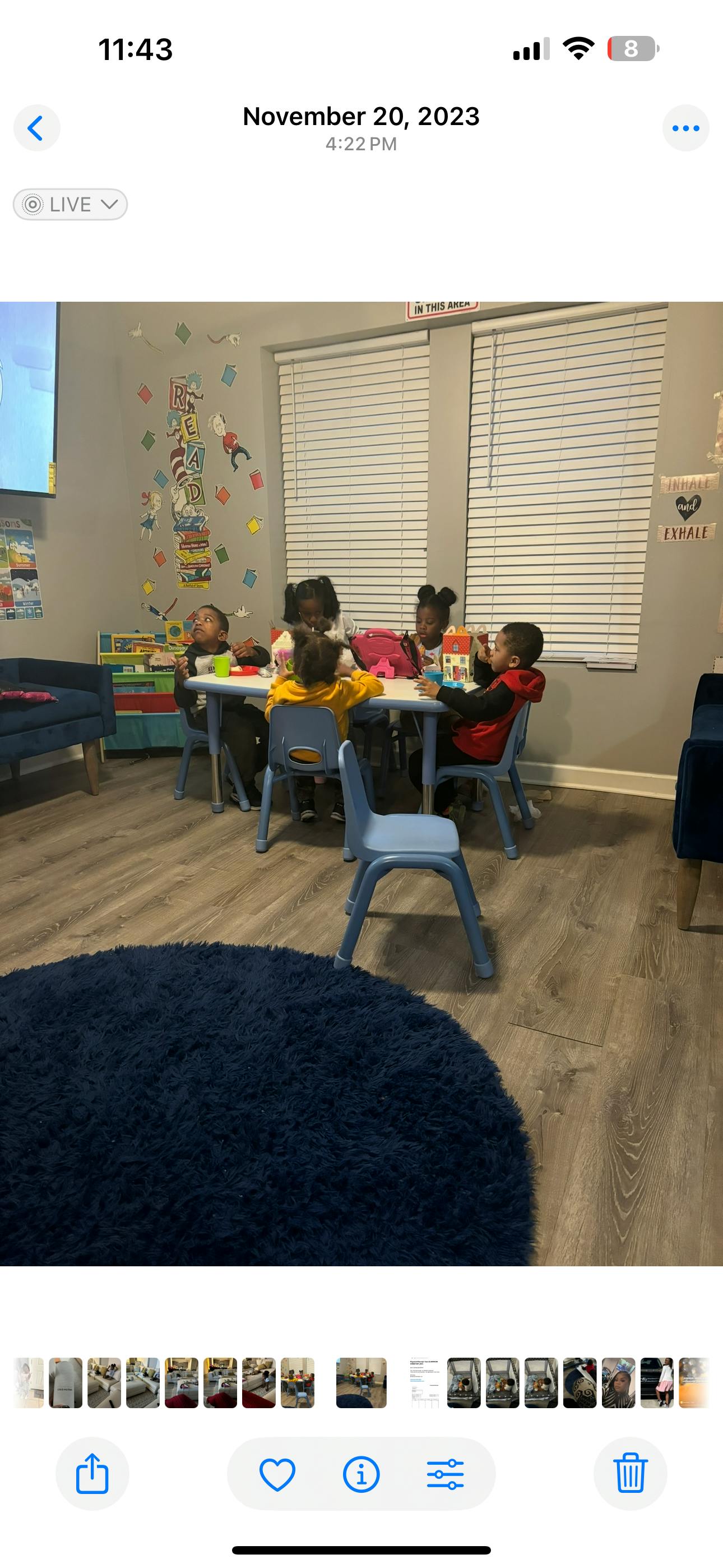 Children sitting at a table in a classroom