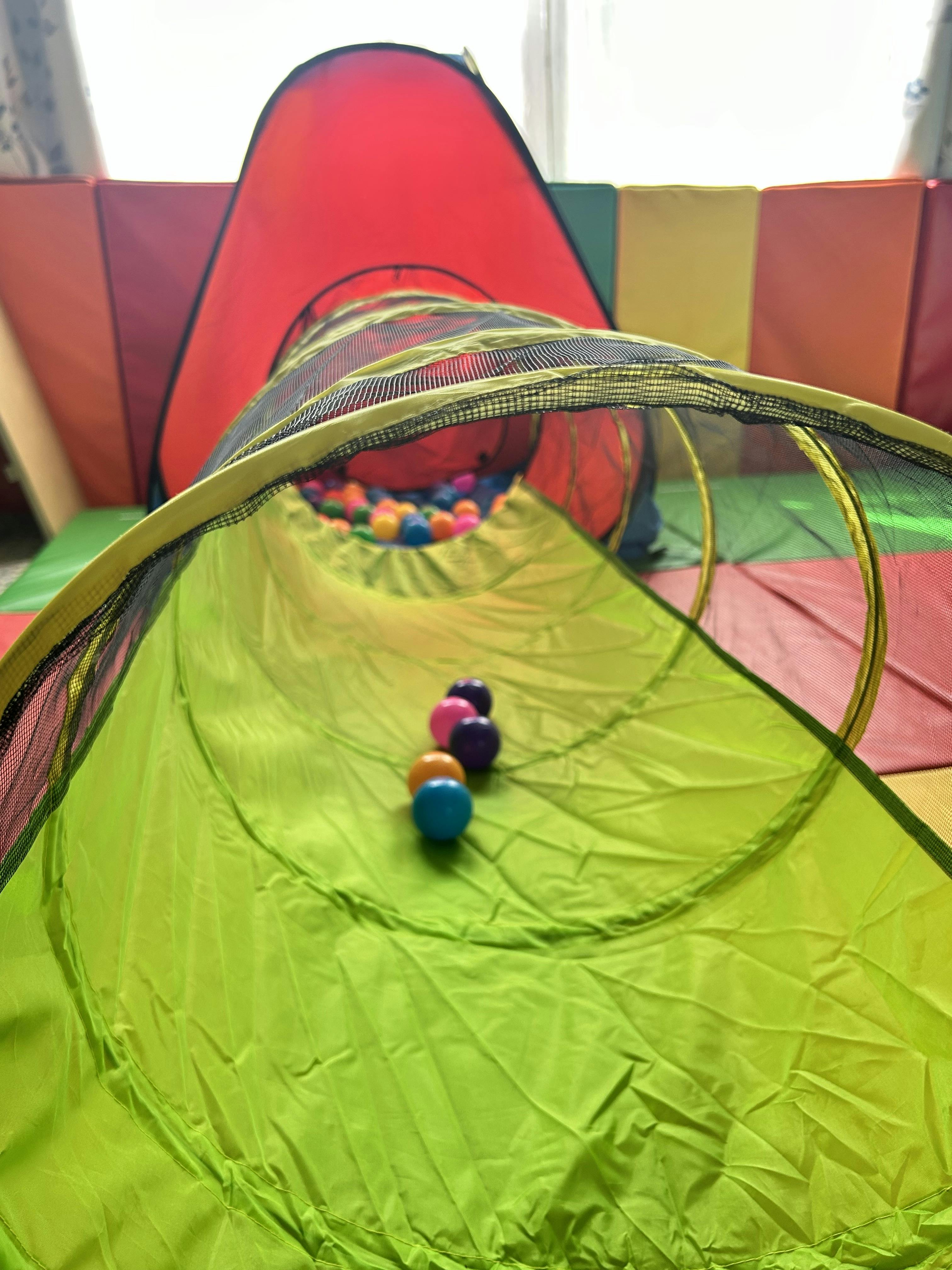 Play tunnel with small colorful balls inside