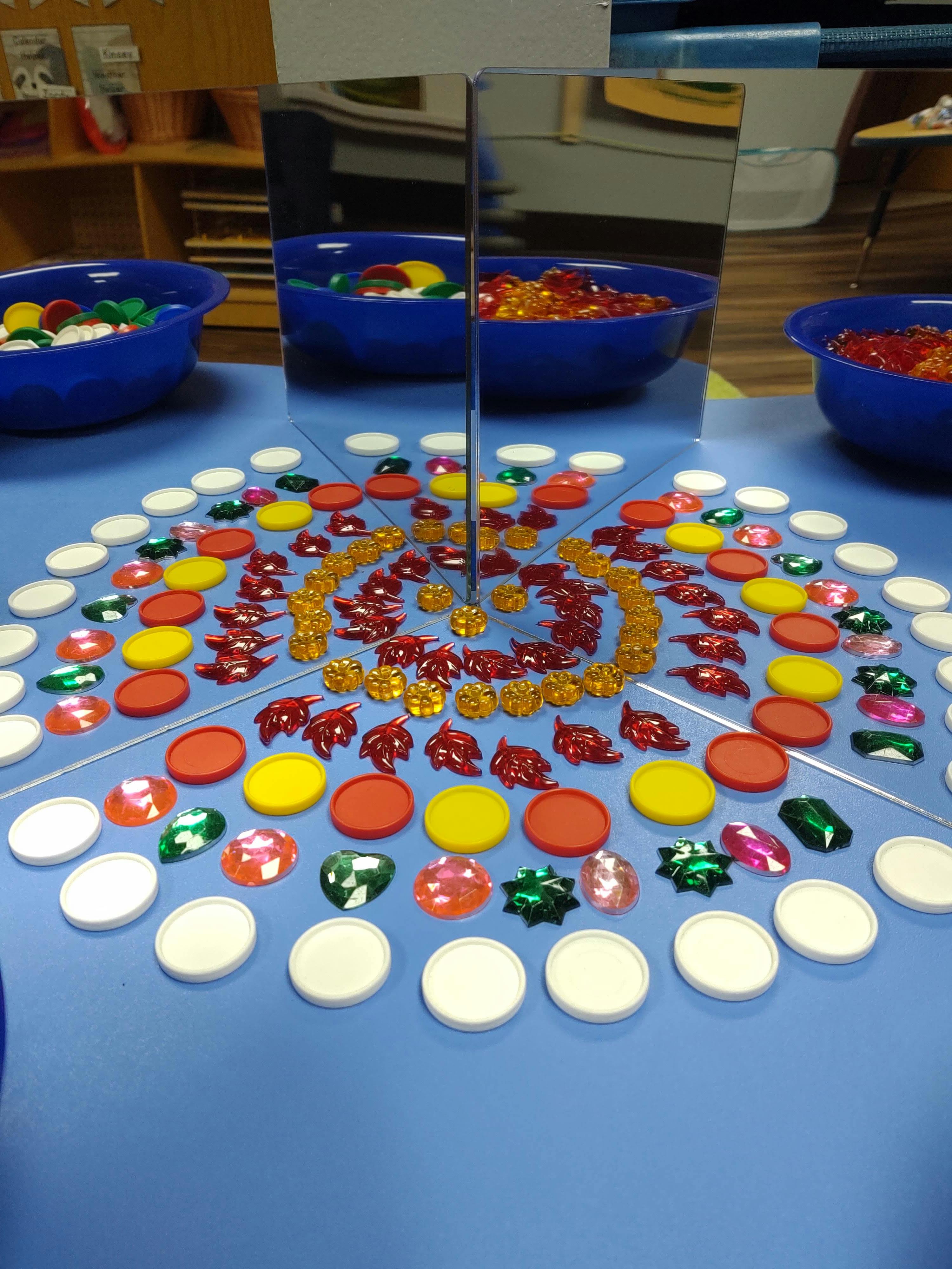 Mirrors reflecting colorful game pieces and bowls of game pieces