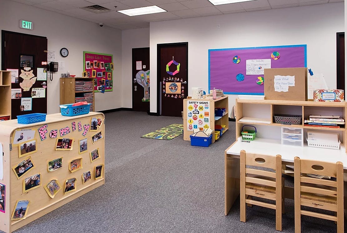 Empty classroom with small desks and chairs