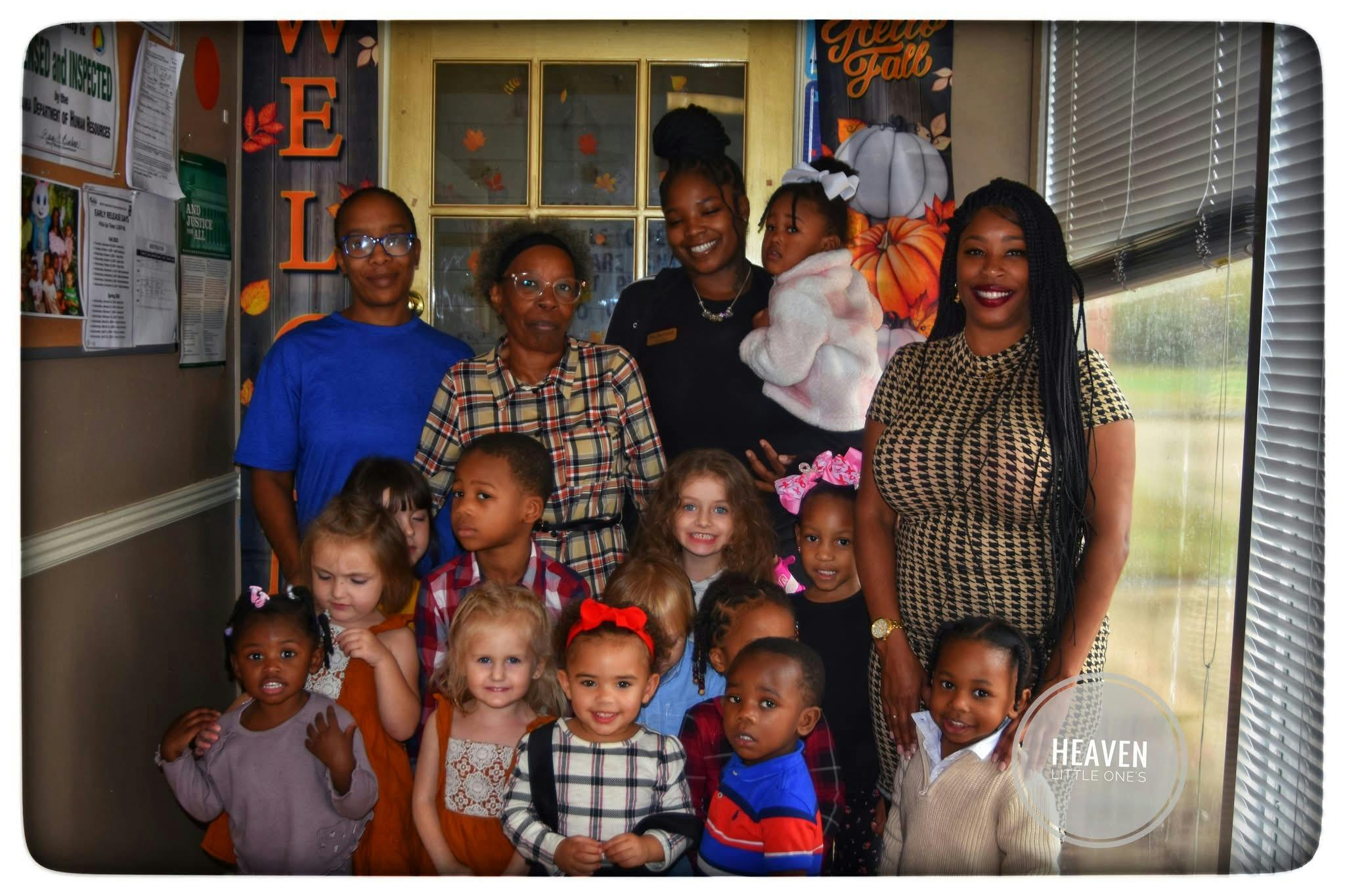 Group of adults and children posing together