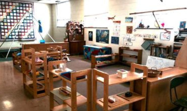 Classroom with wooden shelves and learning materials