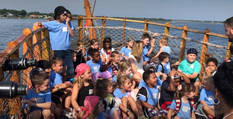 Many children on a boat