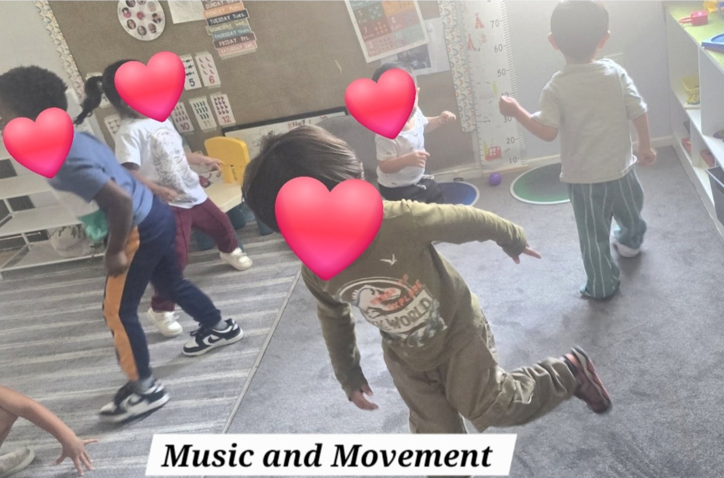 Group of children dancing in a classroom