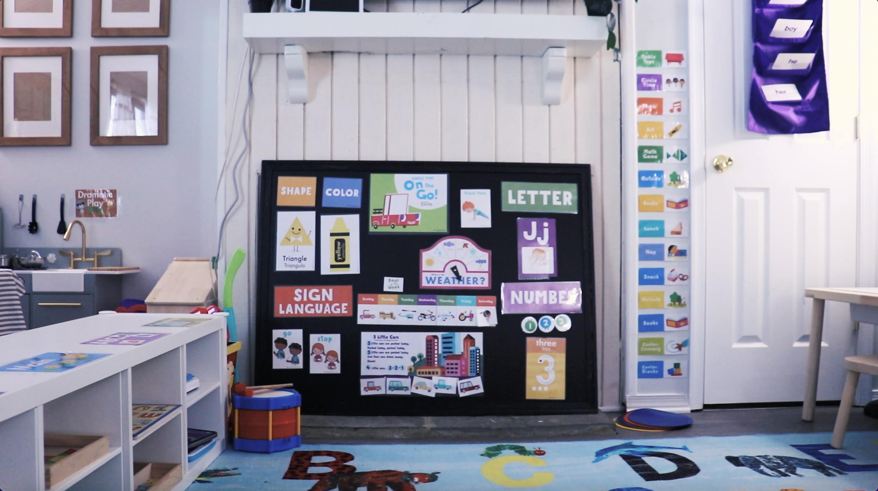 Classroom with a bulletin board displaying "Sign Language" and other learning materials
