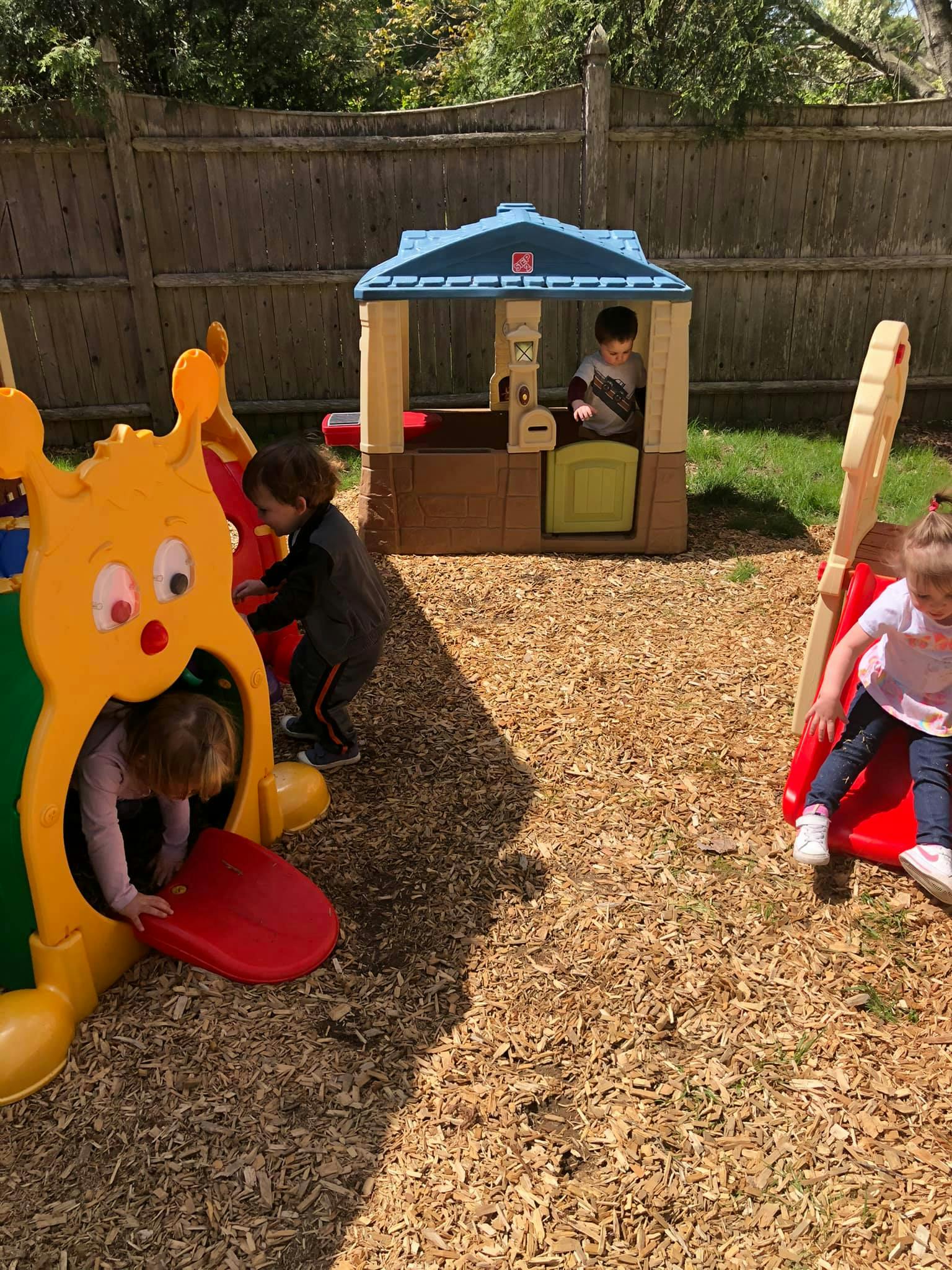 Children playing on outdoor playground equipment