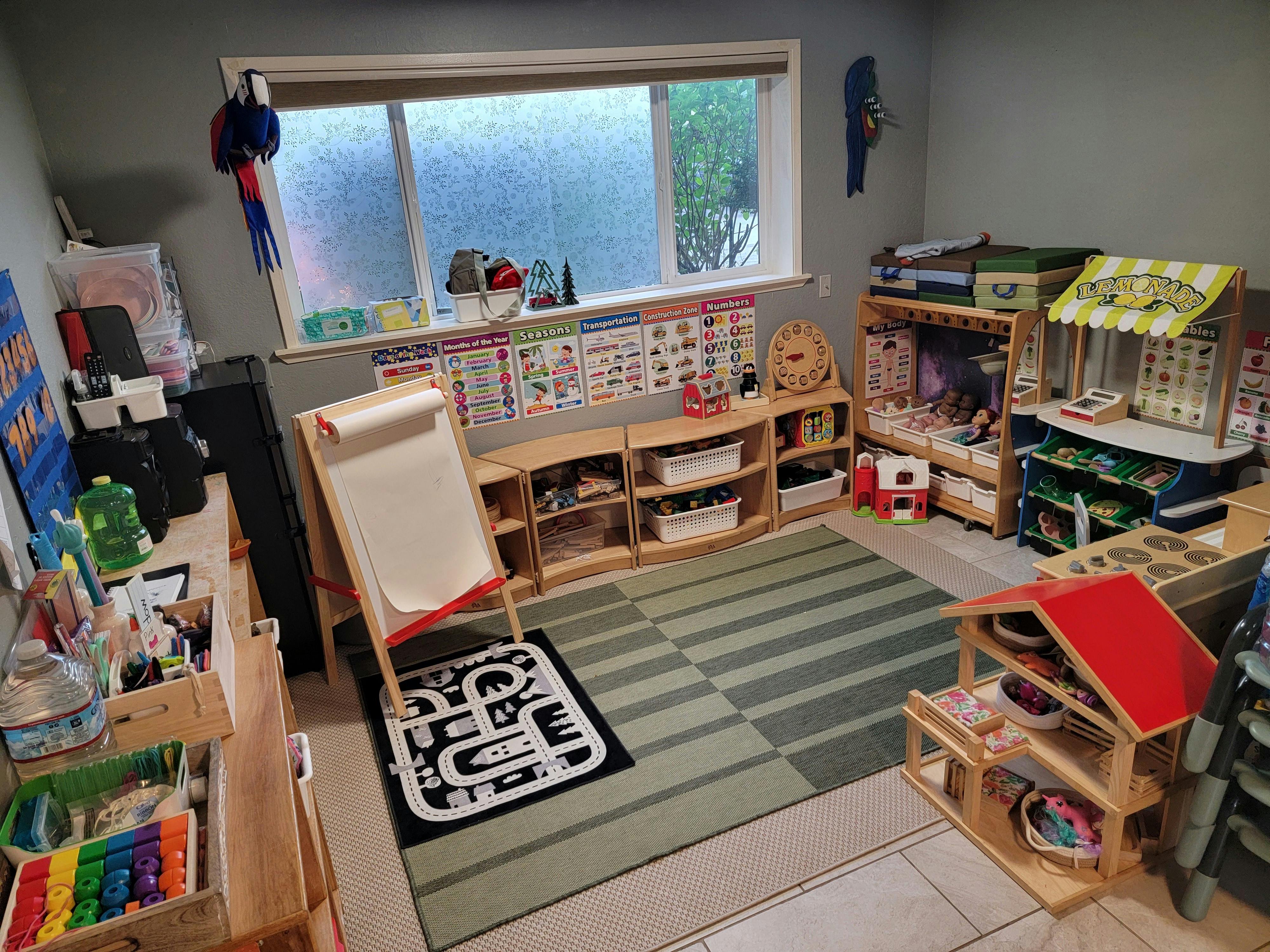 Playroom with toys, shelves, and a window