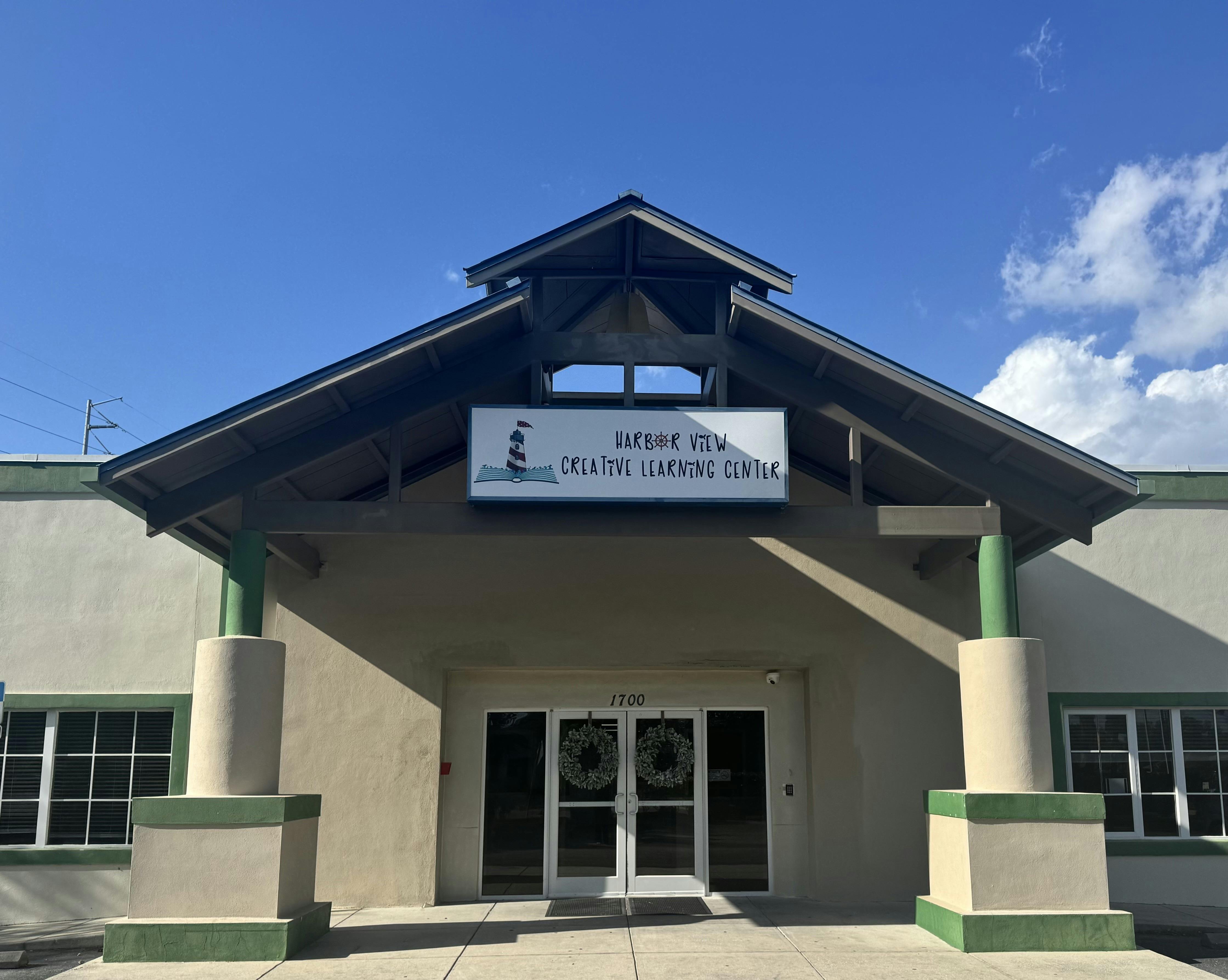 Building entrance with a sign that reads "Harbor View Creative Learning Center"