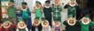 Group of people and children posing for a photo