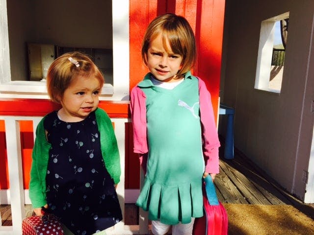 Two children standing next to each other
