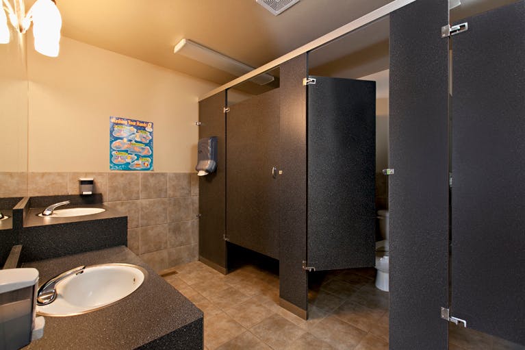 Public restroom with sinks and toilet stalls