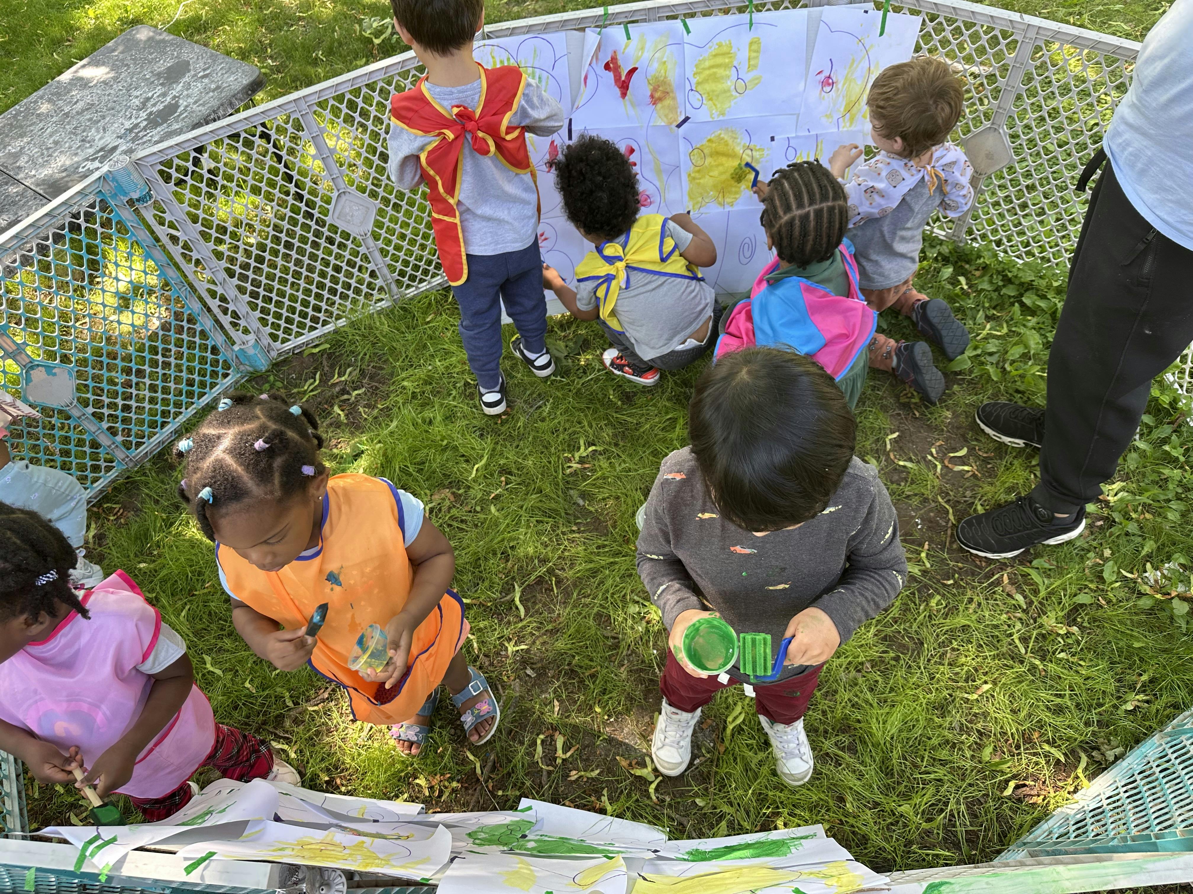 Children painting outdoors