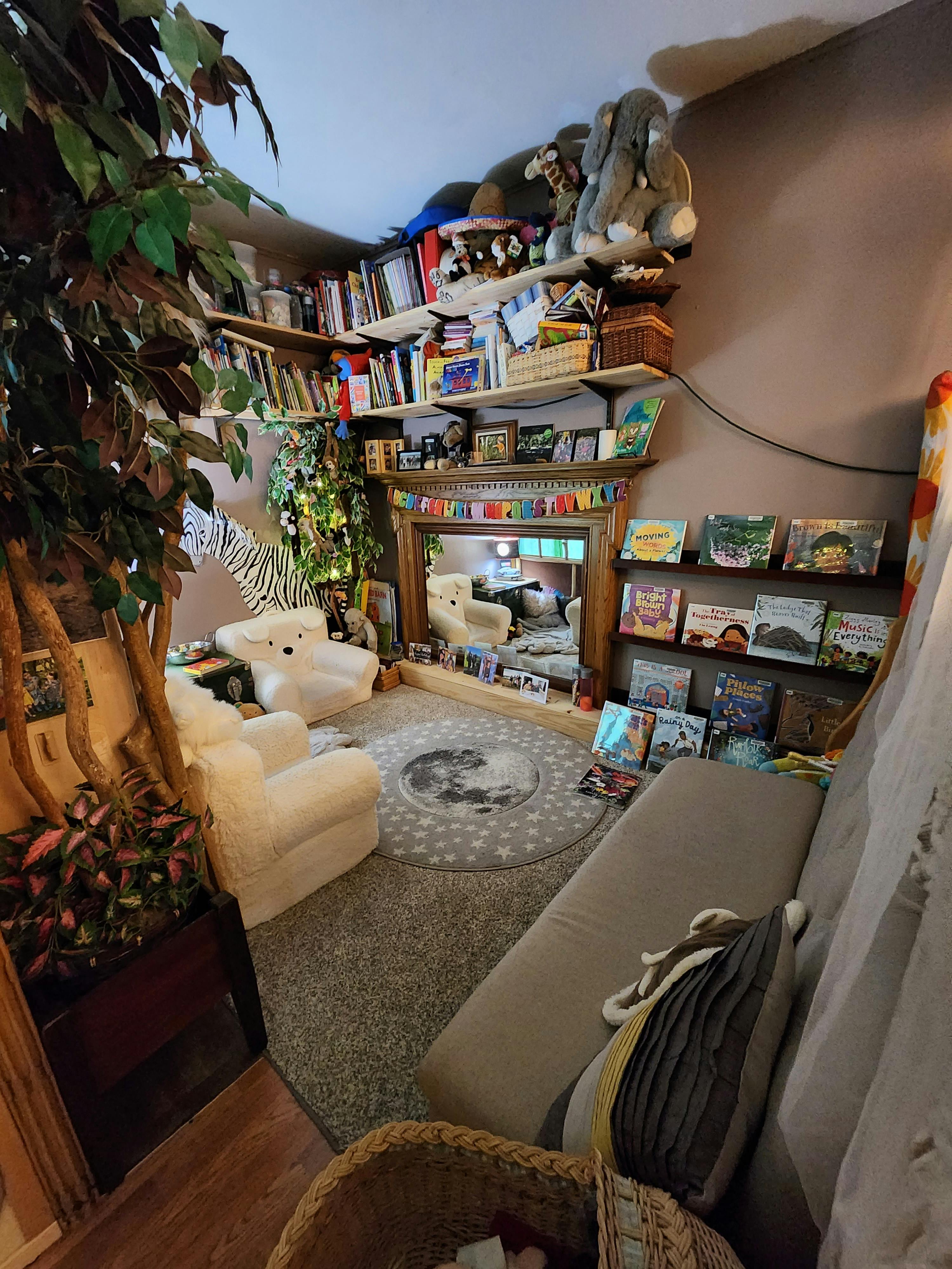 Cozy room with bookshelves, armchairs, and a sofa