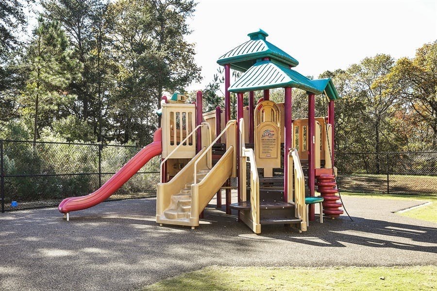 Playground structure with slides and stairs
