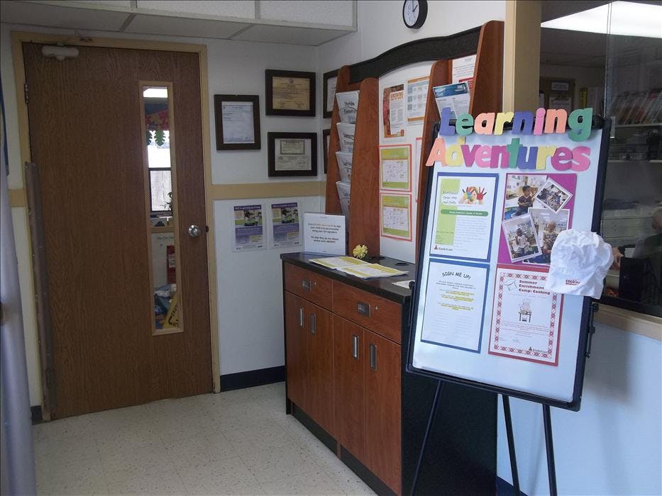 Learning Adventures display board next to a door