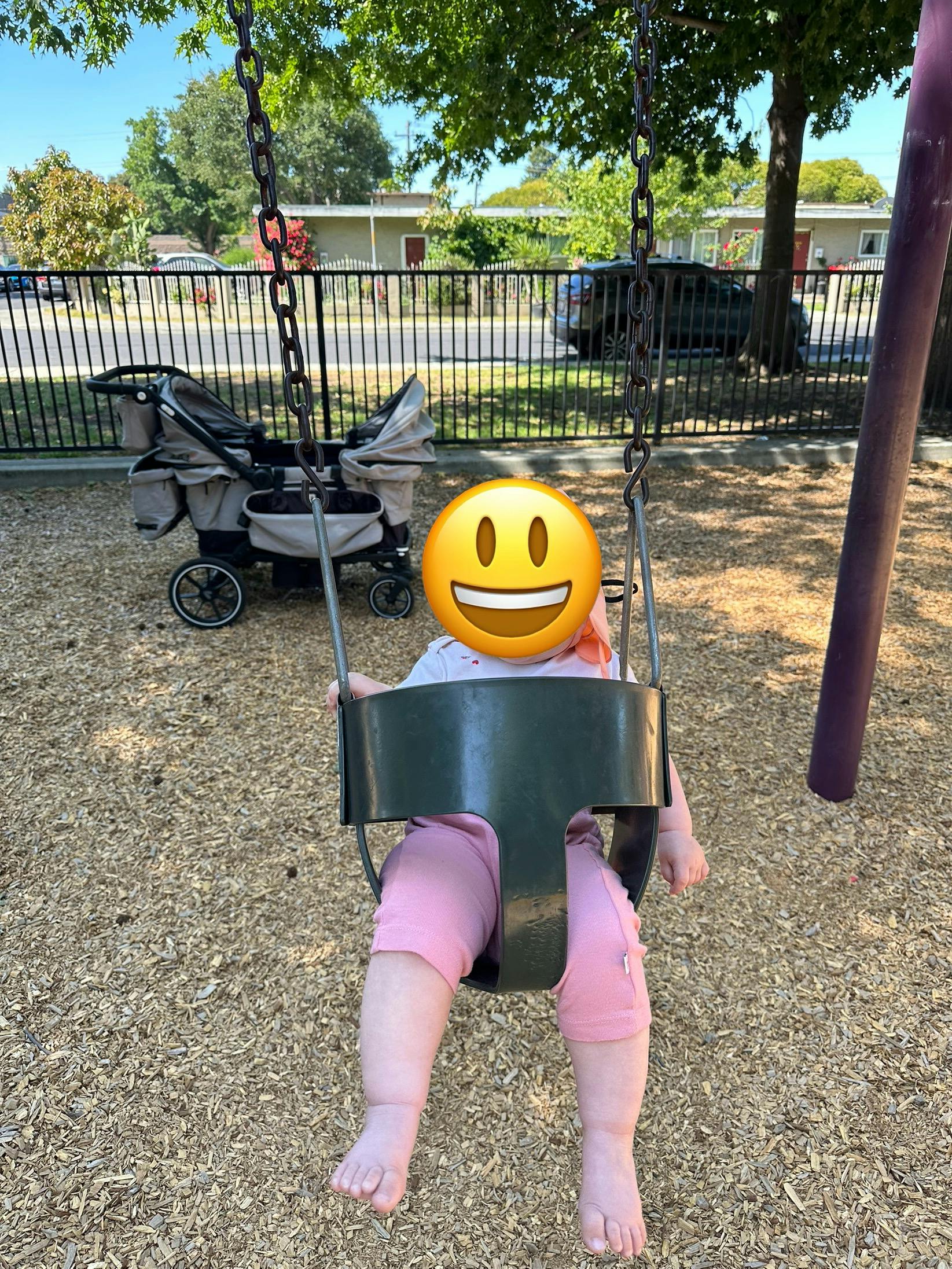 Child in a swing at a playground