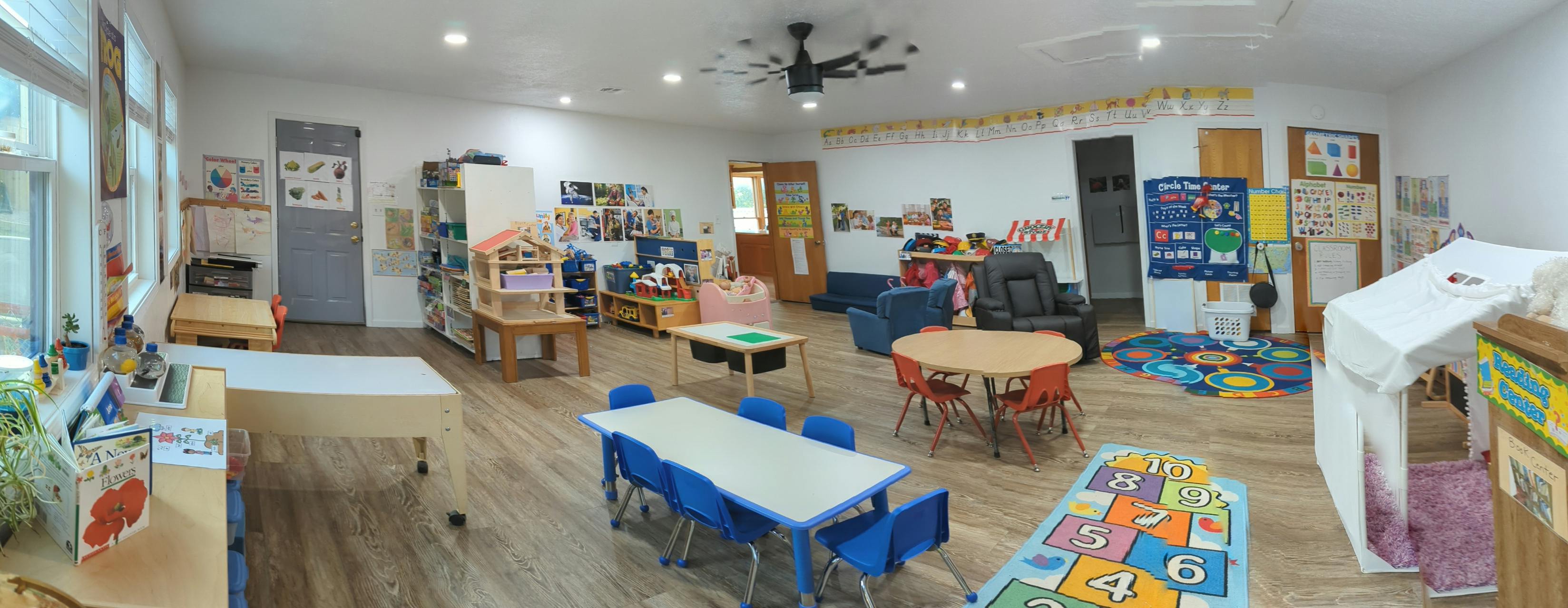Classroom with tables, chairs, and learning materials