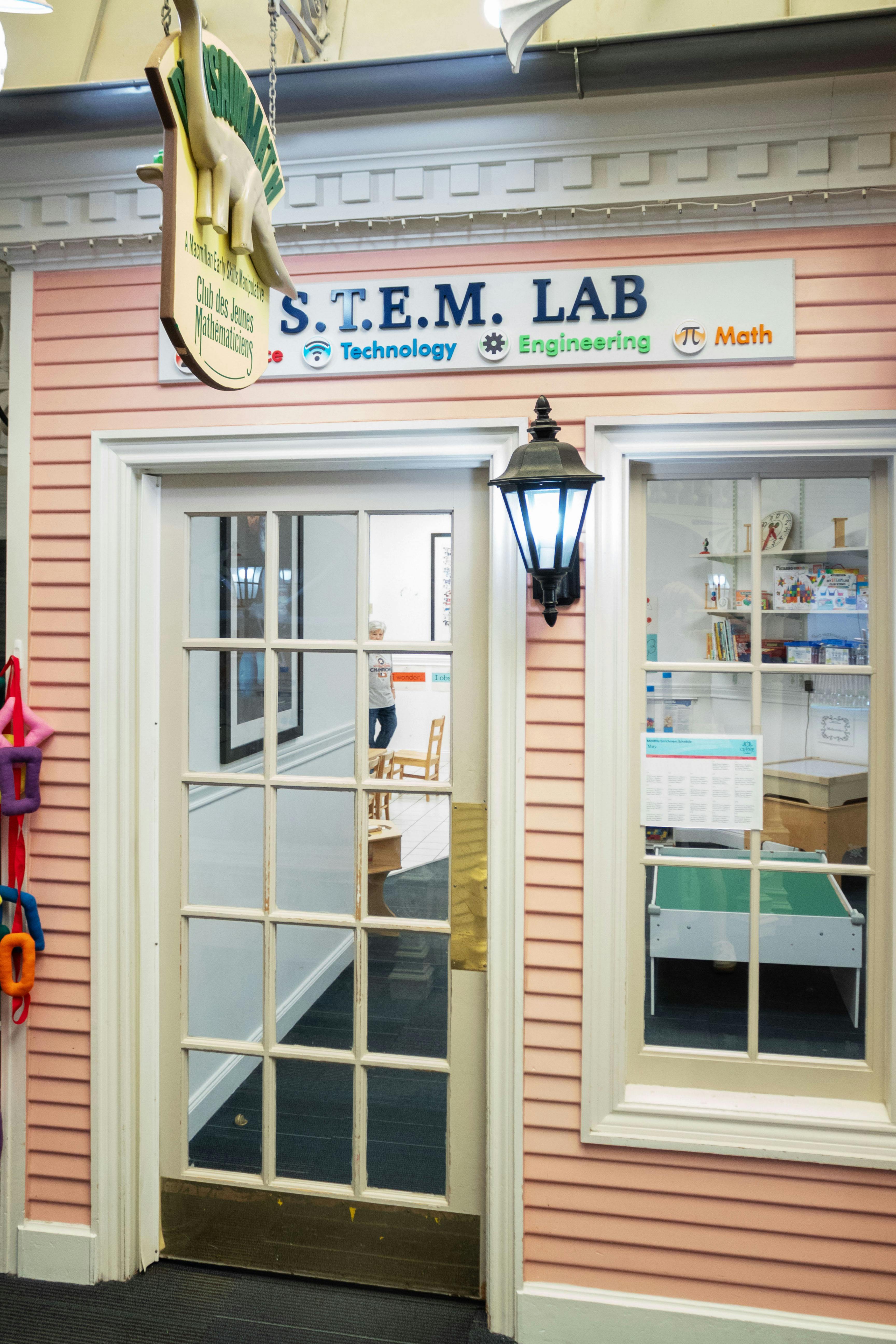 STEM Lab entrance with a dinosaur sign above