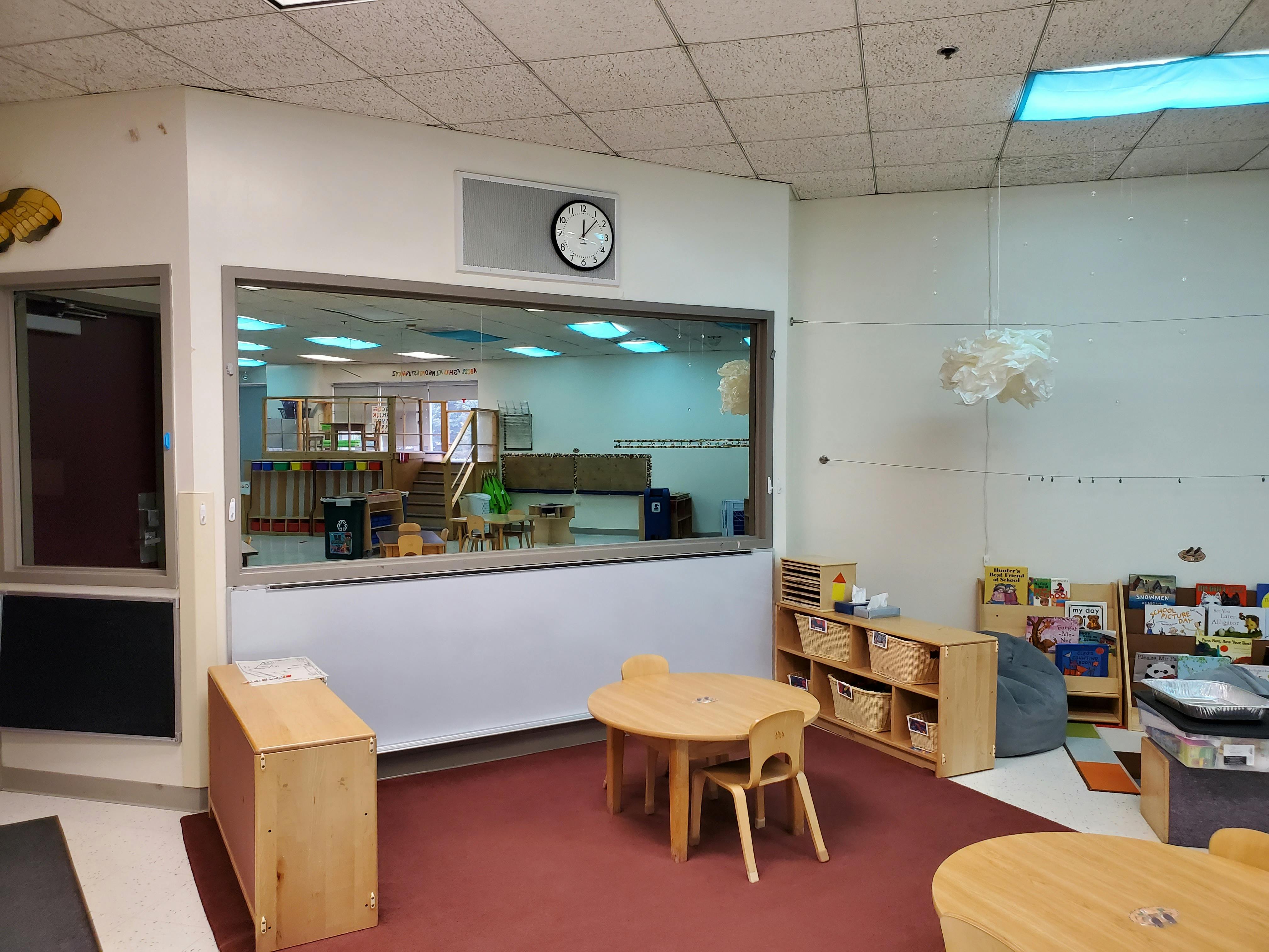 Classroom with a large interior window looking into another room