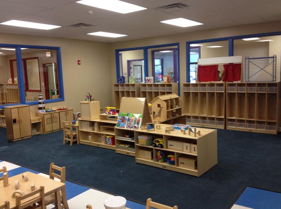 Empty classroom with wooden shelves and cubbies